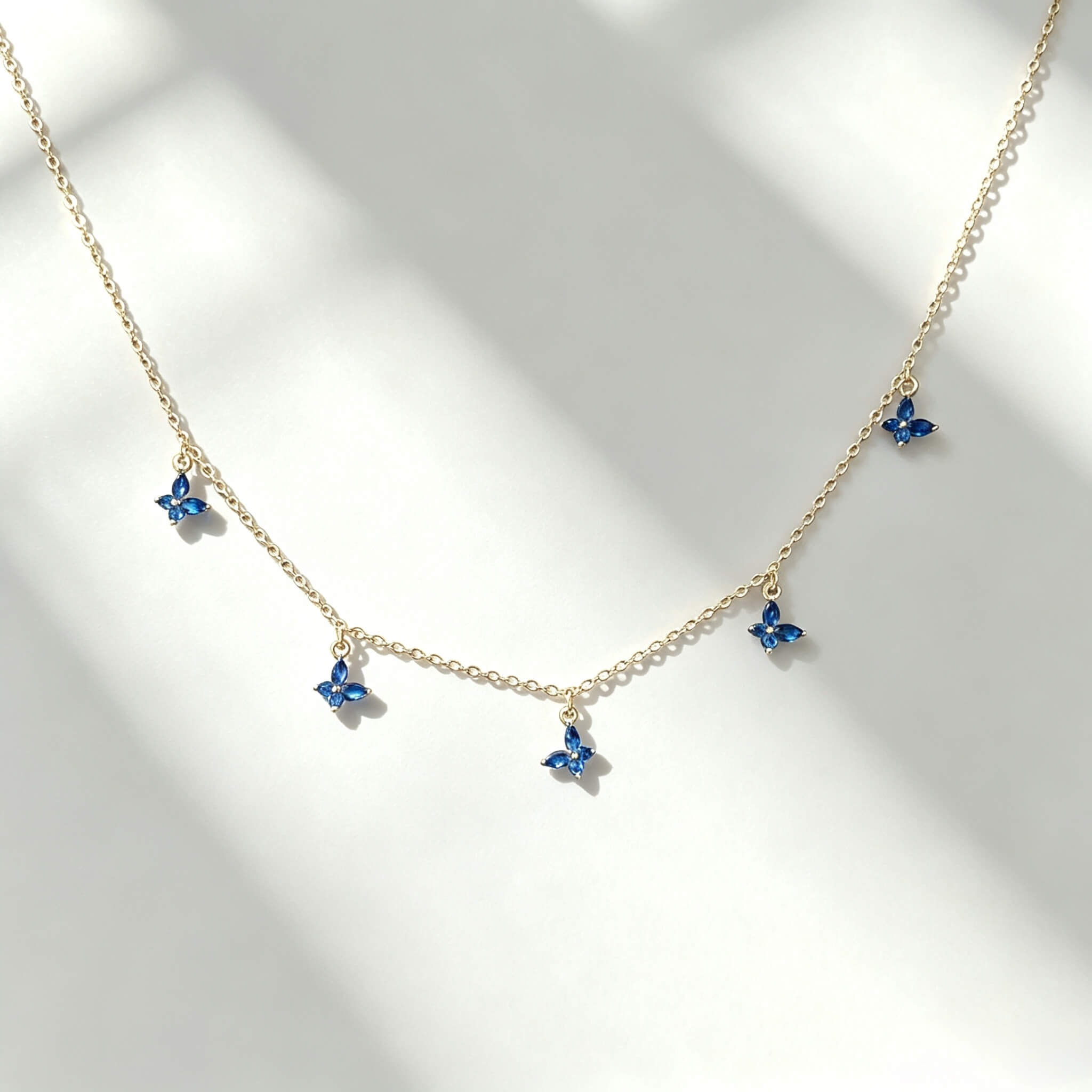 S925 sterling silver 14K gold plated butterfly necklace with marquise‑cut blue spinel and cubic zirconia five butterfly charm